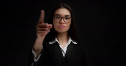 Business lady gestures to keep her mouth shut,keep secrets,not tell anyone. Stock Footage 194098124