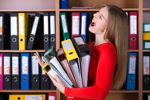 Business Lady holding large Stack of Office Folders Stock Photos
