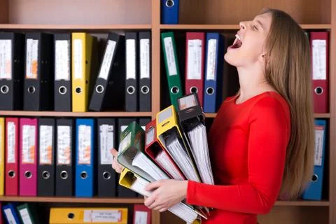 Business Lady holding large Stack of Office Folders Stock Photos