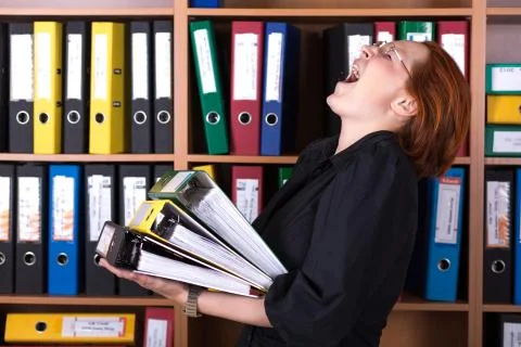 Business Lady holding large Stack of Office Folders Stock Photos
