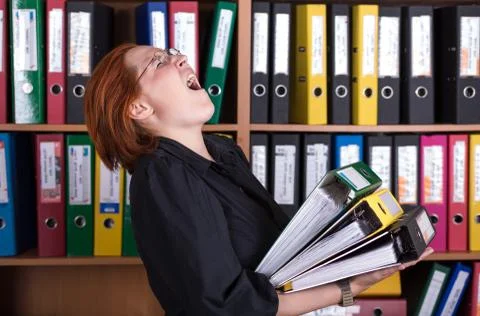 Business Lady holding large Stack of Office Folders Stock Photos