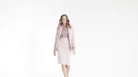 Business lady posing in a grey jacket and trousers on a white background.  Stock Footage 105007921