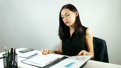 Business lady at work on the contract Video stock 91006791
