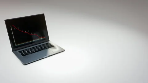 Business laptop with negative falling graph chart opens on white surface Stock Footage 247051985