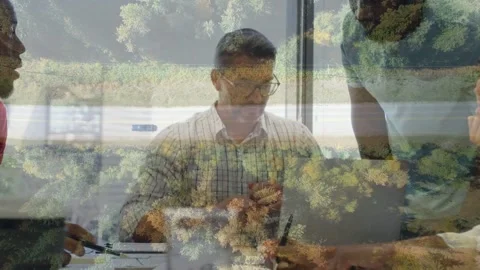 Business lead writing notes as peer pointing at laptop starting doc review under Stock Footage 331736394