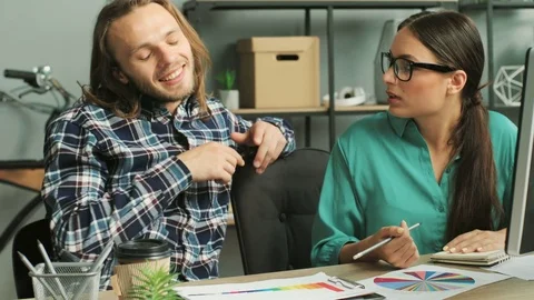 Business man and business woman in the glasses talking about future business Stock Footage