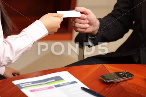 Business man and business woman making a deal Stock Photos