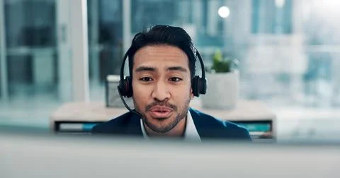 Business, man and computer with headset at call centre for customer service.. Fotos de archivo