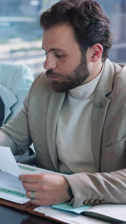 Business, man and talking with document in office for planning, legal advice and Stock Footage 333676176