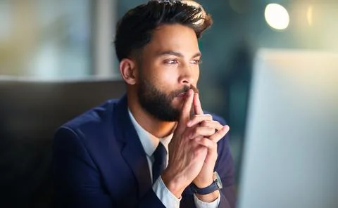 Business, man and thinking with computer in office for problem solving, trading Stockfoto's