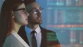 The business man and a woman discussing on the hologram background 4k or 4k+ Resolution