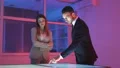 The business man and a woman working with a virtual display 4k or 4k+ Resolution