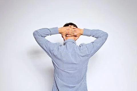 Business man from the back - looking at something over a white background Stock Photos
