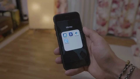 Business man browsing bitpay app account on smartphone checking his bitcoin b Vídeos de archivo 102797428