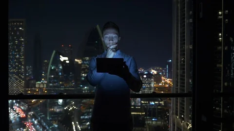 Business Man Browsing Web Online Using Mobile Device in City Office at Night  Stock Footage 103600212