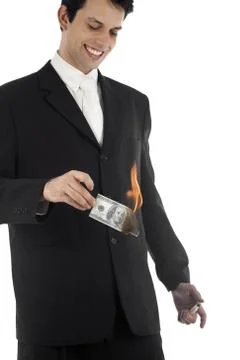 Business Man Burning Money Foto stock