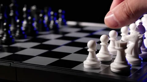 Business man chess at table. Player makes a move, developing chess strategy. Stock Footage 145073989