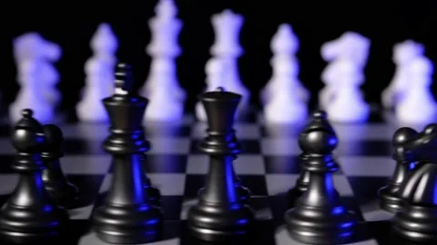 Business man chess at table. Player makes a move, developing chess strategy. Stock Footage 145273315