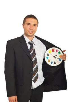 Business man with clock in interior of jacket Stock Photos