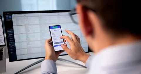 Business Man Coding Invoice On Smartphone App For Tax Audit. 写真素材