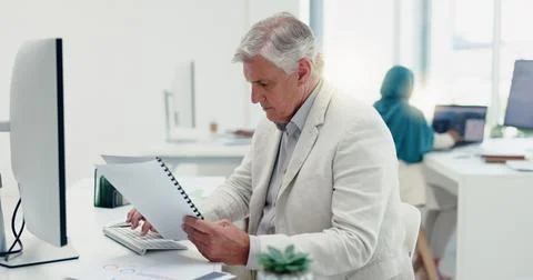 Business man, computer and documents while working in a office for data analysis Stock Photos