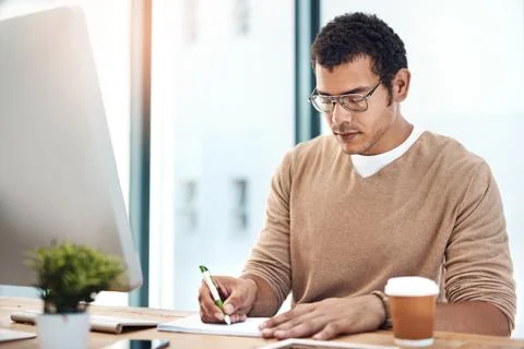 Business man, computer and notebook for writing notes, planning and drawing Stock Photos