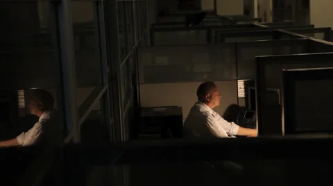 Business man at computer working late at the office Stock-Footage 46025116