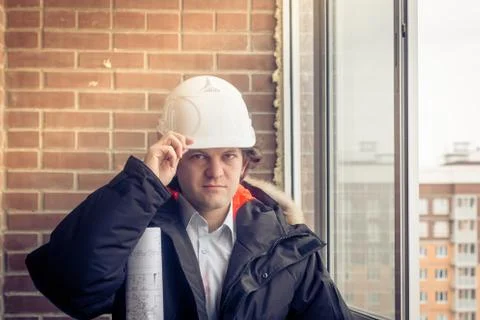 Business man construction engineer worker in protective helmet and blueprints Stock Photos