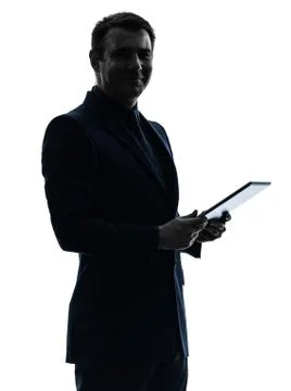 Business man  digital tablet  posing portrait silhouette Stock Photos