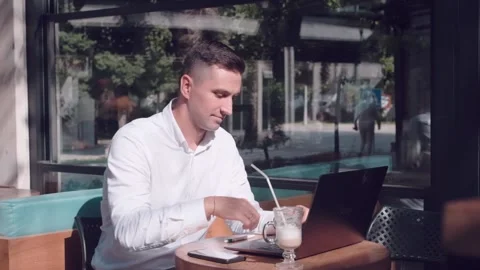 Business man does some calculation in the phone Stock Footage 220568364