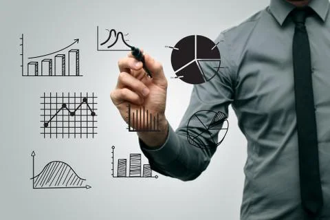 Business man drawing different graphs and charts Stock Photos