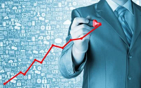 Business man drawing a growing graph Illustrazione stock