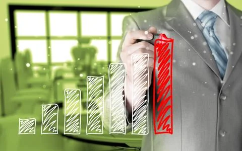 Business man drawing a growing graph Illustrazione stock