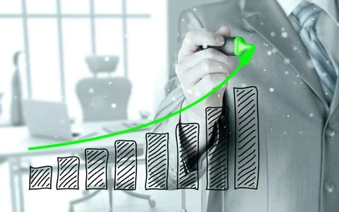 Business man drawing a growing graph Illustrazione stock
