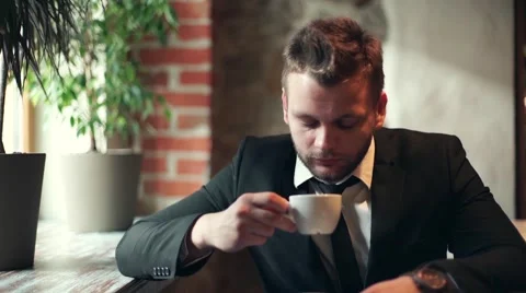 Business man drinking coffee in cafe Stock Footage 55759352