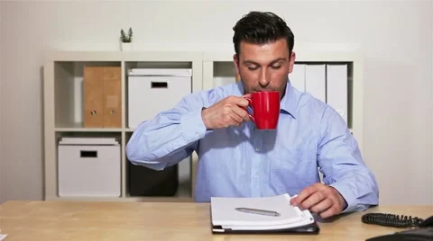 Business man drinking coffee Stock Footage 11019317