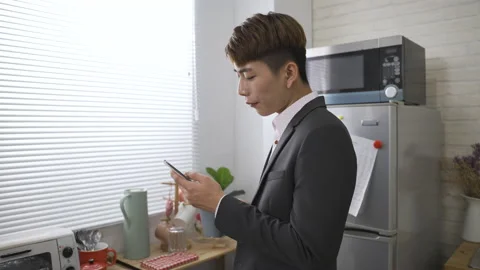 Business man drinking coffee looking at the phone Video stock 158674598