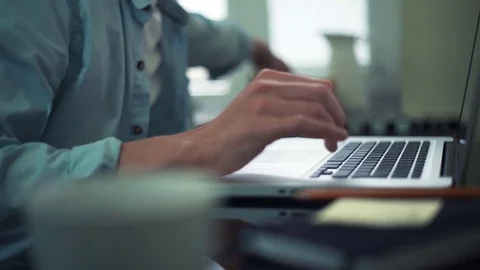 Business man eating banana using laptop at home. Man working out off office. Stock Footage 82931153