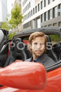 Business Man In Electric Sports Car