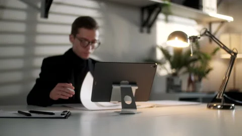 Business Man Engineer Is Working With Blueprints And Laptop In Modern Workplace Stock Footage 132834106