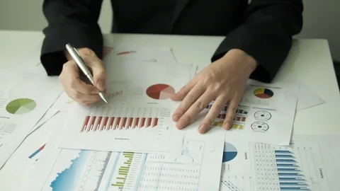 Business man examining with paperwork Stock Footage 87246548