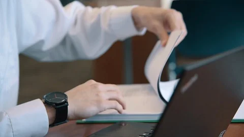Business Man Flipping Through Notebook Stock Footage 86881024