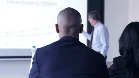 Business man giving a presentation in conference room Stock Footage 59379242