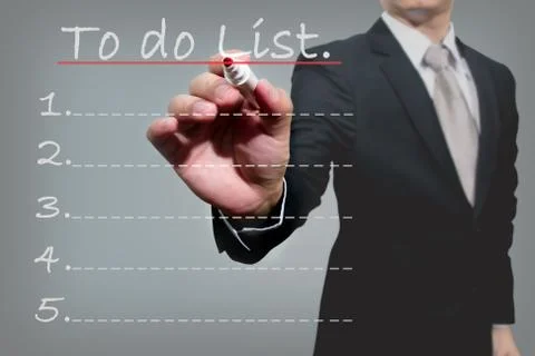 Business man hand checking the to do list. Stock Photos