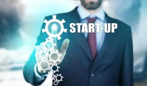 Business man hand start-up text in screen Stock Photos