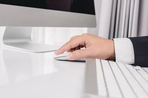 Business man hand using computer mouse Stock Photos