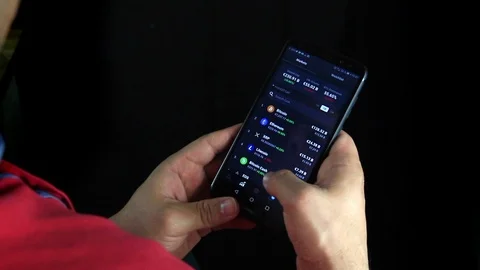 Business man hands checking Bitcoin Cryptocurrency portfolio list. Stock Footage 110923487