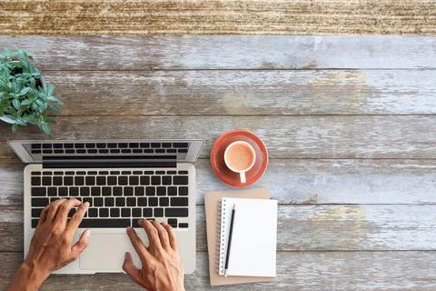 Business man hands using a laptop on workplace Stock Photos