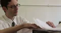 Business man happy to find papers HD Footage