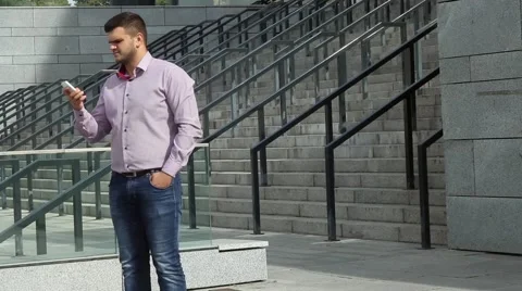 Business man is happy while talking on the phone Stock Footage 55534604